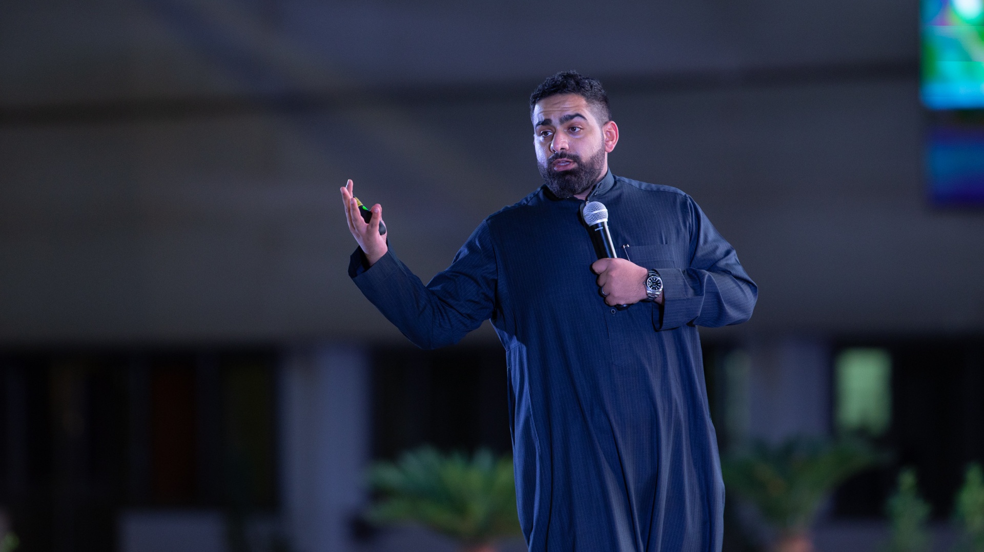 Wael Altorabi speaking on stage